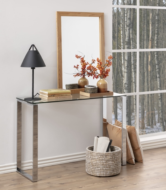 Minimalistyczna konsola na metalowej podstawie ze szklanym blatem